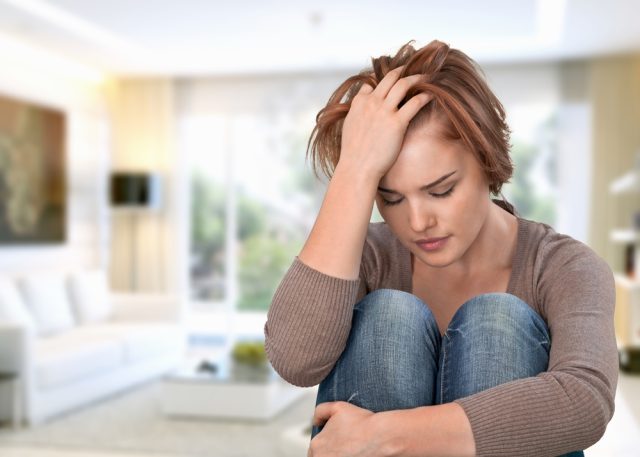 Tired,Frustrated,Girl,At,Home,,Headache,,Crisis,Concept An anxious, depressed woman