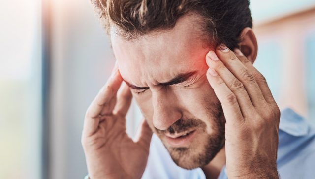 Headache,,Man,And,Massage,Temple,With,Pain,For,Dizziness,,Tired A man experiencing a headache