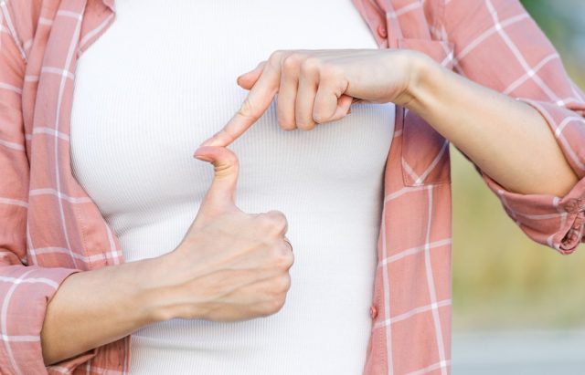 Woman showing a hyper-flexible thumb