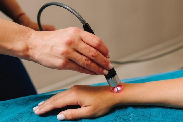 Hand low level laser therapy to promote healing of soft tissues