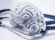 The figure of the human brain with a stethoscope around it