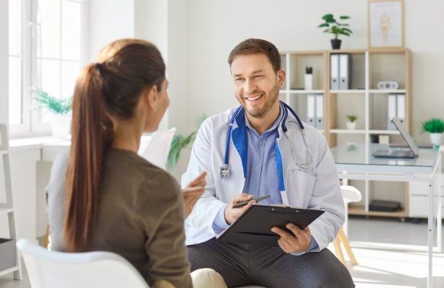 Female patient having a pleasant conversation with her doctor