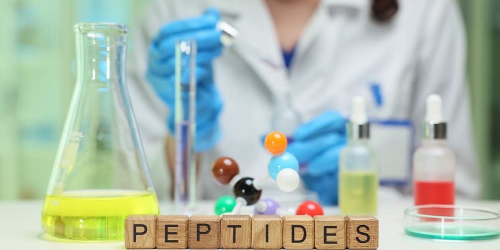 A laboratory setting that showcases extensive peptide research, featuring colorful models and advanced lab equipment